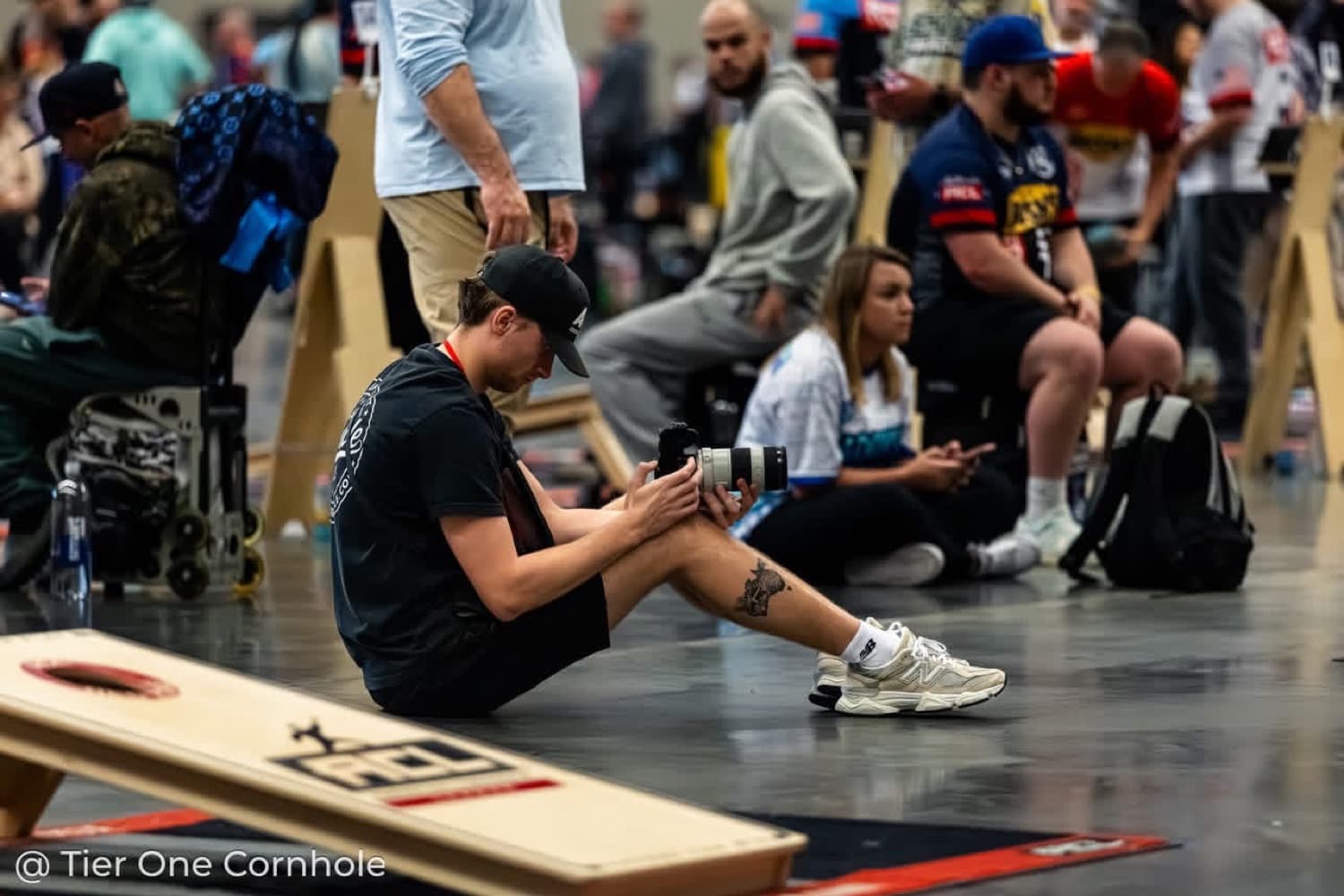 Zack courtside at a cornhole event
