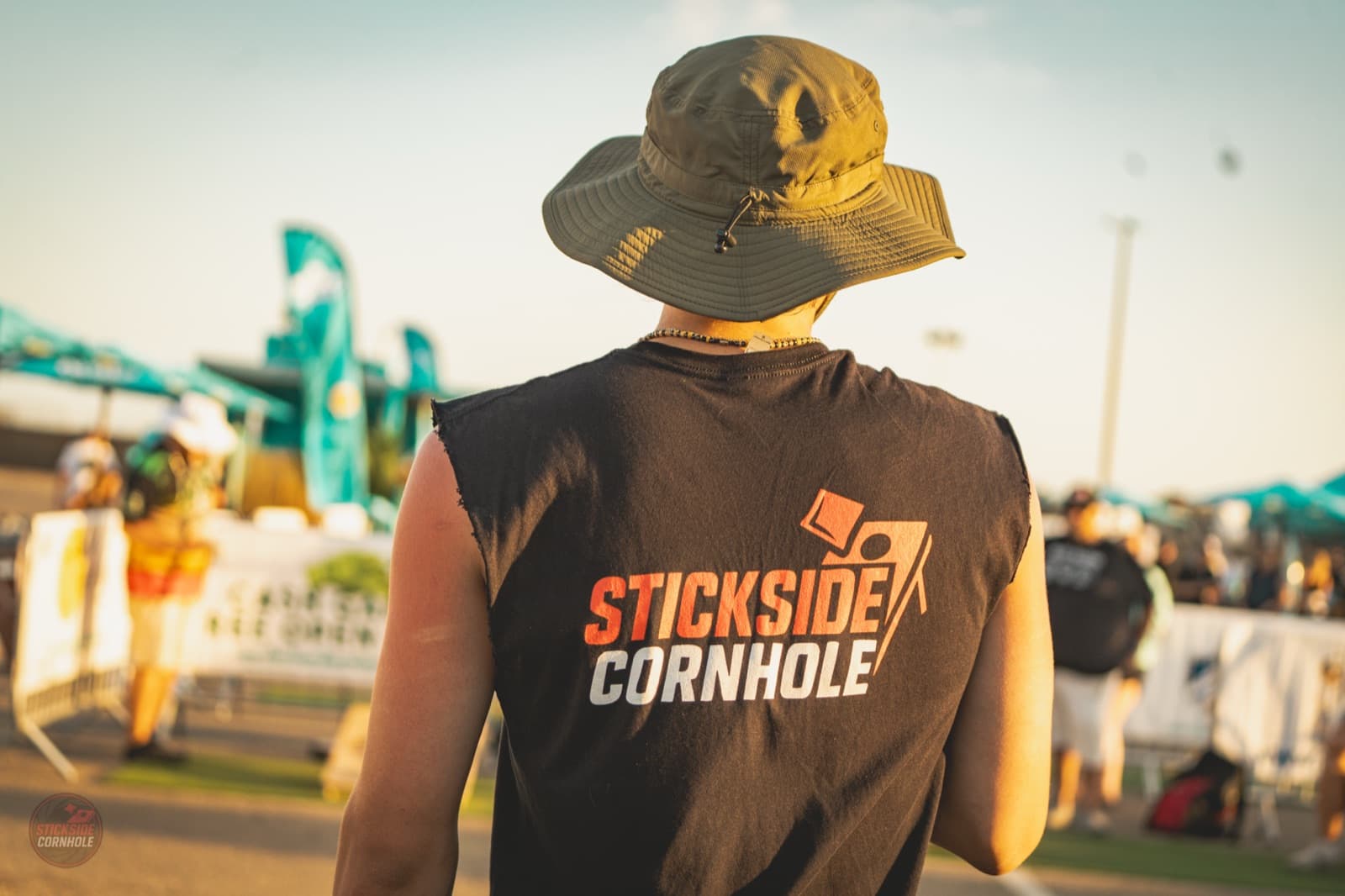 Stickside Cornhole tank top, flexing at the event