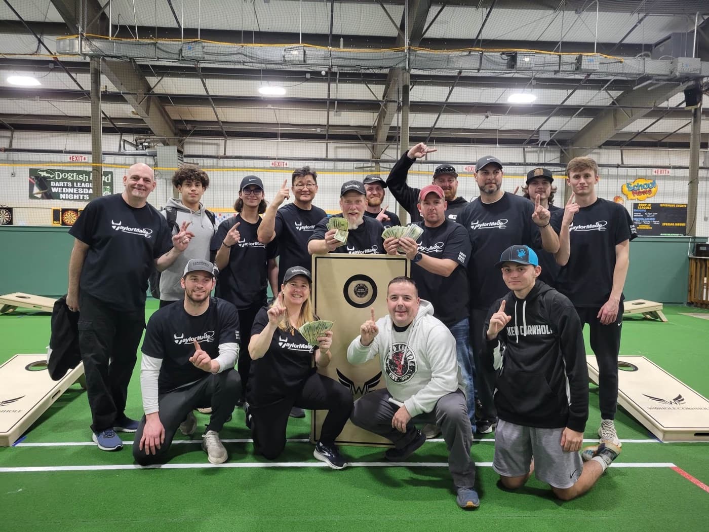 A Wicked Cornhole league team celebrating a tournament win