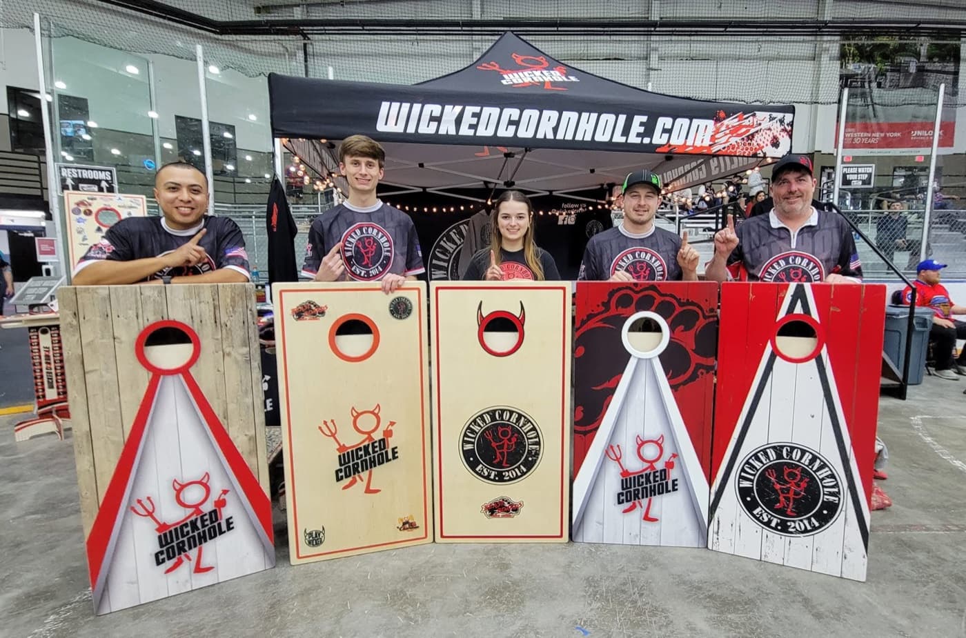 The Wicked Cornhole boards lineup at the event booth